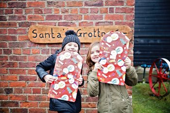 Children outside Santa's grotto